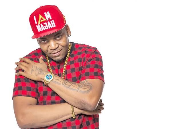 Majah Hype in a red cap and red-and-black shirt